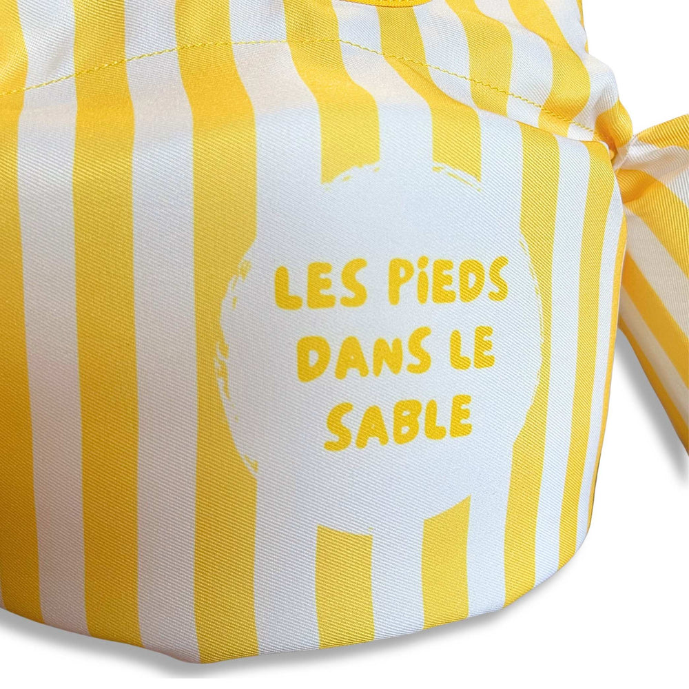 Les pieds dans le sable